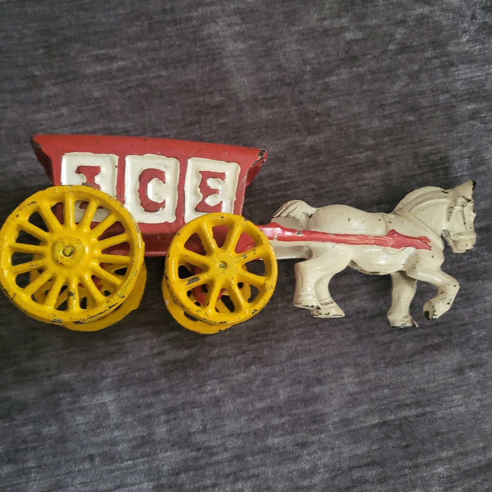 Vintage cast iron horse- drawn stagecoach